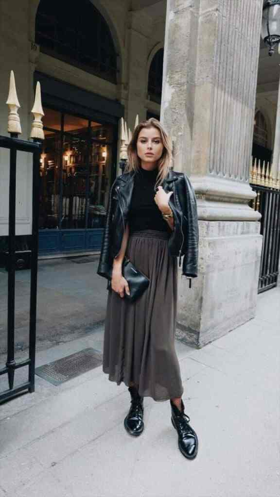 7 Estilos Universais: Quais Joias combinam com Cada um Deles? - Estilo dramatico urbano 1 Mulher top, saia e jaqueta preta - 7 estilos universais: quais joias combinam com cada um deles?